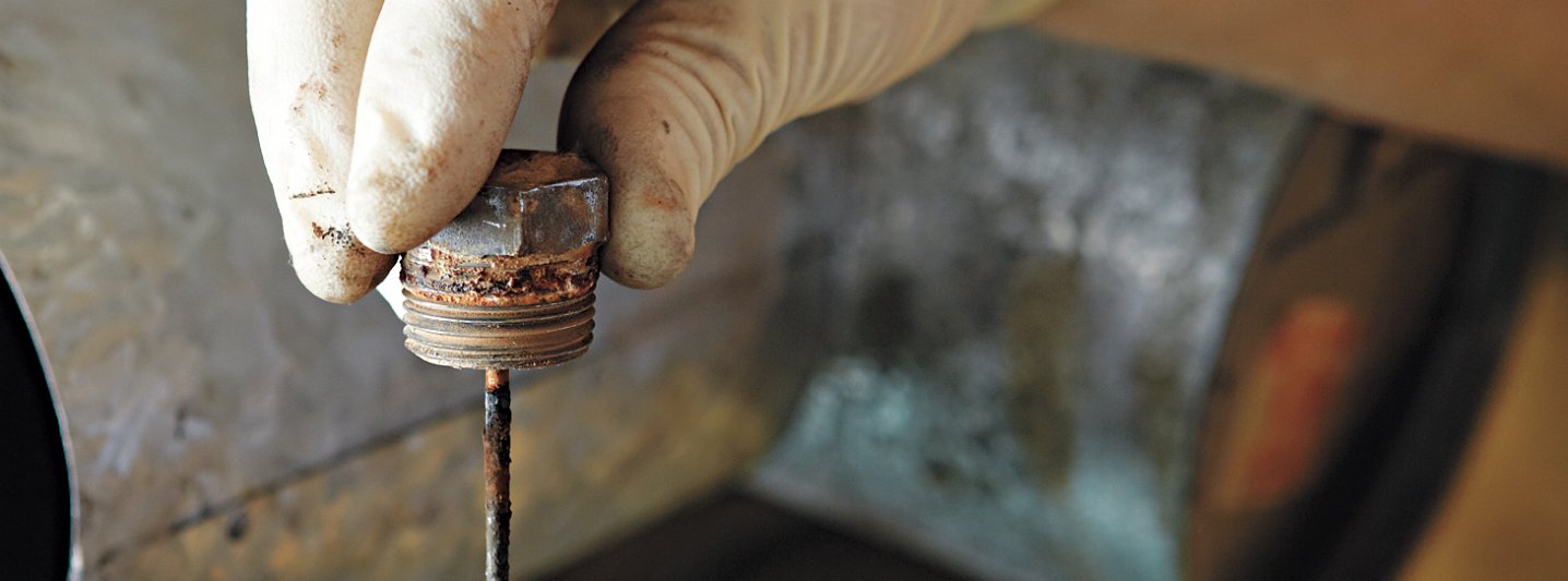 Image of a water heater anode rod during maintenance